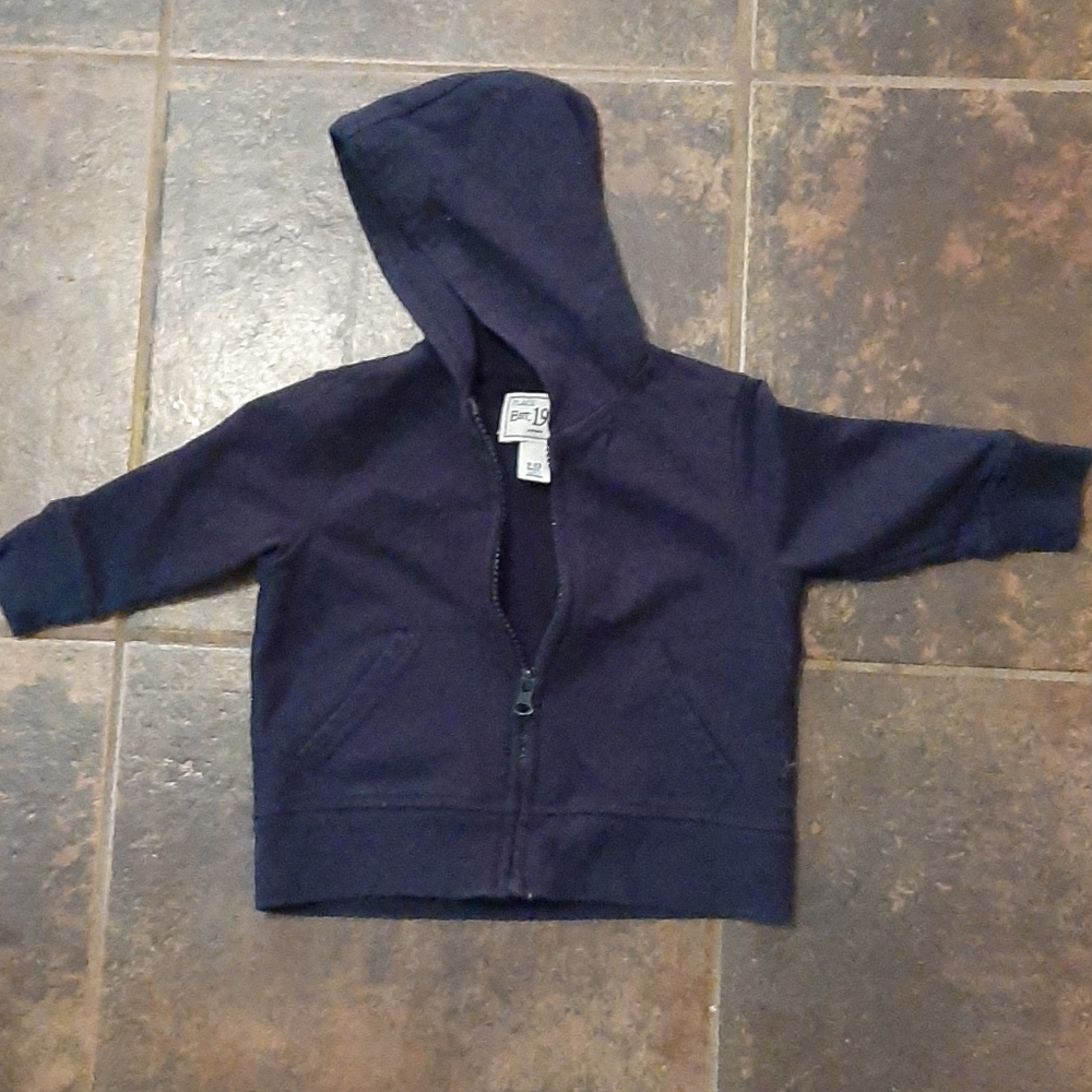 Solid navy blue zip up jacket.